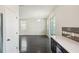 Spacious living room with dark hardwood floors and access to kitchen at 10710 Southern Forest Dr, Riverview, FL 33578
