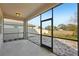 Screened patio with view of the backyard and open fields at 10710 Southern Forest Dr, Riverview, FL 33578