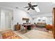 Light-filled home office featuring hardwood floors and built-in shelving at 909 Dawn St, Venice, FL 34285