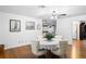 Dining area with hardwood floors, round table, and white chairs at 12631 Timber Run, Dade City, FL 33525