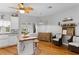 Modern kitchen with white cabinets, a butcher block island and hardwood floors at 12631 Timber Run, Dade City, FL 33525