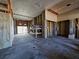 Unfinished basement with garage door and workbenches at 13737 Victor Ave, Hudson, FL 34667