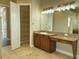 Spa-like bathroom with vanity, granite countertop and linen closet at 13737 Victor Ave, Hudson, FL 34667