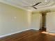 Spacious bedroom with wood floors and ceiling fan at 13737 Victor Ave, Hudson, FL 34667