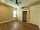 Bedroom with wood floors and a closet at 13737 Victor Ave, Hudson, FL 34667