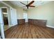 Bedroom with wood floors, built-ins, and ensuite bath at 13737 Victor Ave, Hudson, FL 34667