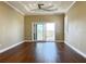 Main bedroom with wood floors, sliding door to balcony, and water views at 13737 Victor Ave, Hudson, FL 34667