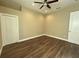 Bedroom with hardwood floors and double door closet at 13737 Victor Ave, Hudson, FL 34667