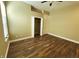 Bright bedroom with wood floors, ceiling fan, and walk-in closet at 13737 Victor Ave, Hudson, FL 34667