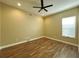 Spacious bedroom with hardwood floors and ceiling fan at 13737 Victor Ave, Hudson, FL 34667