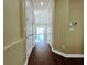 Bright hallway with wood floors and access to other rooms at 13737 Victor Ave, Hudson, FL 34667