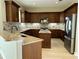 Modern kitchen with granite countertops and island at 13737 Victor Ave, Hudson, FL 34667