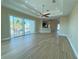 Living room with hardwood floors, sliding doors, and water views at 13737 Victor Ave, Hudson, FL 34667