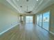 Main bedroom with hardwood floors, ceiling fan, and water views at 13737 Victor Ave, Hudson, FL 34667