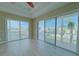 Main bedroom with sliding glass doors opening to a balcony at 13737 Victor Ave, Hudson, FL 34667