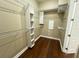 Well-organized walk-in closet with custom shelving at 13737 Victor Ave, Hudson, FL 34667