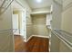 Custom-built walk-in closet with shelving and hanging rods at 13737 Victor Ave, Hudson, FL 34667