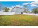 Spacious backyard with a newly built home and white fence at 27096 Wakefield Dr, Brooksville, FL 34602