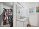 Double vanity bathroom with granite countertop and walk-in closet at 27096 Wakefield Dr, Brooksville, FL 34602