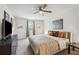 Spacious bedroom with king-size bed, ceiling fan, and large window at 27096 Wakefield Dr, Brooksville, FL 34602