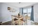 Bright dining area with table and chairs, and sliding glass doors leading to backyard at 27096 Wakefield Dr, Brooksville, FL 34602