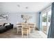 Bright dining area with table and chairs, and sliding glass doors leading to backyard at 27096 Wakefield Dr, Brooksville, FL 34602