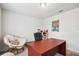 Bright home office features a desk, chair, and comfortable seating at 27096 Wakefield Dr, Brooksville, FL 34602