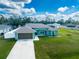 Single-story house with a large backyard and a two-car garage at 4154 Duluth Ter, North Port, FL 34286