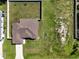 Aerial view of a house and yard, showing a large backyard and neighborhood at 4154 Duluth Ter, North Port, FL 34286