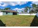 Large backyard with a white vinyl fence, providing ample privacy at 4154 Duluth Ter, North Port, FL 34286