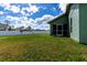 Large backyard with grassy lawn and privacy fence at 4154 Duluth Ter, North Port, FL 34286