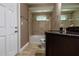 Main bathroom with a tub, granite countertop, and toilet at 4154 Duluth Ter, North Port, FL 34286