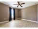 Bedroom features wood-look floors and a ceiling fan at 4154 Duluth Ter, North Port, FL 34286