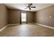 Bright bedroom with wood-look tile floors and a large window at 4154 Duluth Ter, North Port, FL 34286