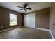 Bright bedroom with wood-look floors and ceiling fan at 4154 Duluth Ter, North Port, FL 34286