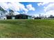 Single-story home with a large green lawn and a two-car garage at 4154 Duluth Ter, North Port, FL 34286