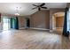 Spacious living room featuring wood-look tile floors and high ceilings at 4154 Duluth Ter, North Port, FL 34286