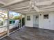 Back porch featuring stained wood decking, ceiling fan, and covered area to enjoy the outdoors at 112 Nippino W Trl, Nokomis, FL 34275