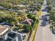 An aerial view showing the home with solar panels and a trampoline in the backyard at 1701 38Th Ave, St Petersburg, FL 33713