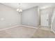 Dining area with neutral walls, carpet flooring, and a chandelier at 13752 Reindeer Cir, Hudson, FL 34669