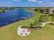 Lakeside community with fire pit and seating area at 13752 Reindeer Cir, Hudson, FL 34669