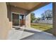 Covered patio with sliding glass doors leading to backyard at 13752 Reindeer Cir, Hudson, FL 34669