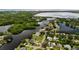 Wide aerial showcasing waterfront homes and lush green landscape with waterways at 237 Tallahassee Ne Dr, St Petersburg, FL 33702