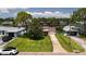 Aerial view of a single-story home with a large backyard and waterfront access at 237 Tallahassee Ne Dr, St Petersburg, FL 33702