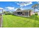 Screened patio and expansive grassy backyard at 237 Tallahassee Ne Dr, St Petersburg, FL 33702