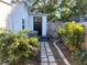 Landscaped backyard with a stone pathway and lush greenery at 4701 22Nd N Ave, St Petersburg, FL 33713