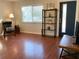 Bright living room with hardwood floors and a cozy armchair at 4701 22Nd N Ave, St Petersburg, FL 33713