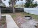 Backyard with fire pit and a walkway at 7848 Teal Dr, New Port Richey, FL 34653