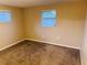 Simple bedroom with neutral wall colors and carpeted floors at 7848 Teal Dr, New Port Richey, FL 34653