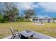 Backyard view with firepit and seating at 4760 84Th N Ter, Pinellas Park, FL 33781